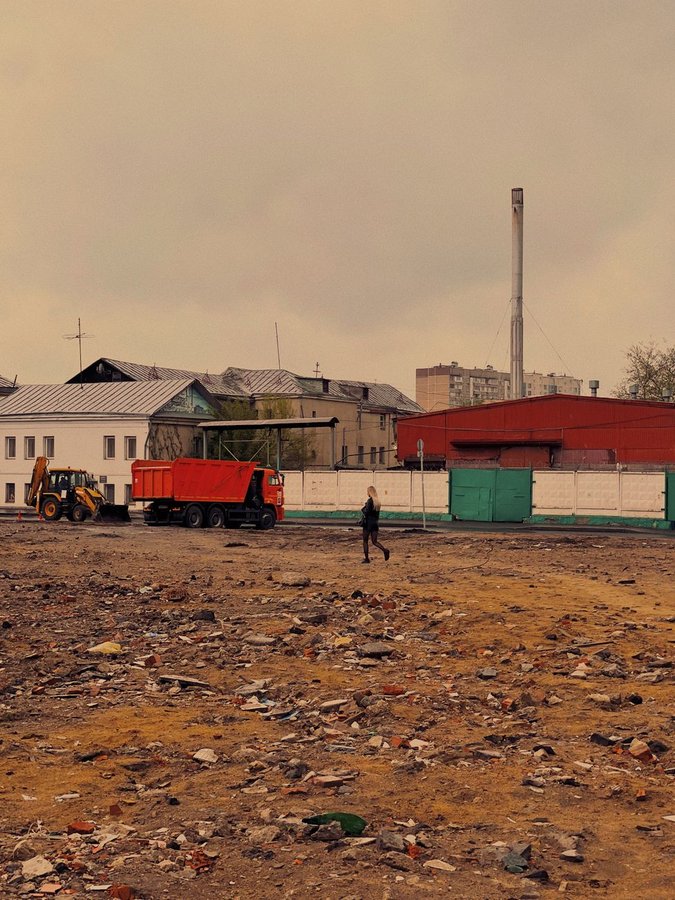 Post-construction site with debris and dust accumulation